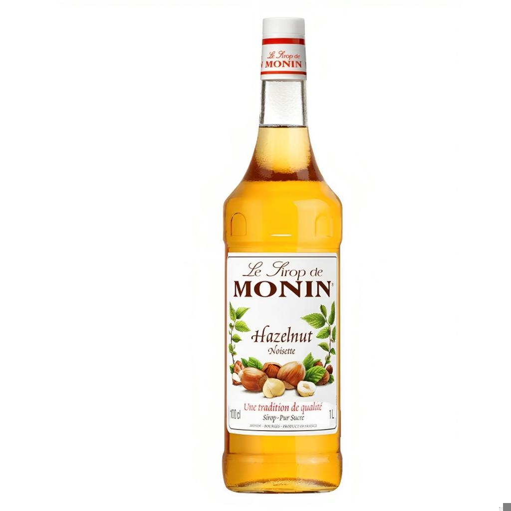 Monin Hazelnut Syrup 1L bottle with clear branding and nut illustrations on the label.